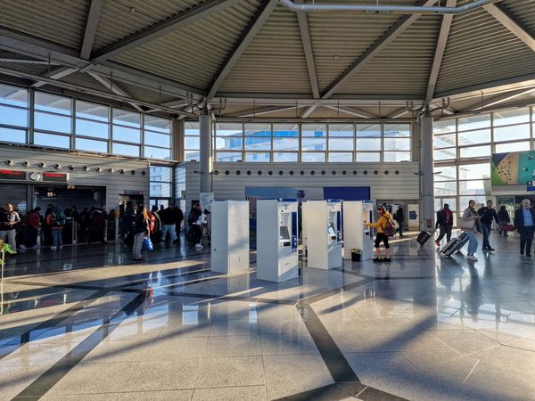 Self-service ticket machines in the Athens airport concourse used for buying metro and bus tickets