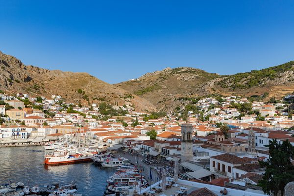 Aerial view of Hydra harbour with stone mansions and moored boats, Saronic Gulf