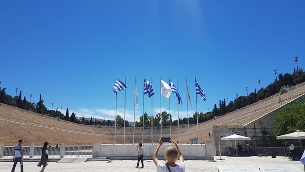The all-marble Panathenaic Stadium in Athens with its open tiers and a row of flags