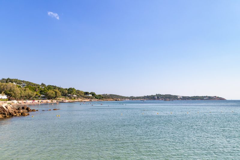Aerial view of Vouliagmeni beach on the Athens Riviera showing turquoise water and sandy coastline