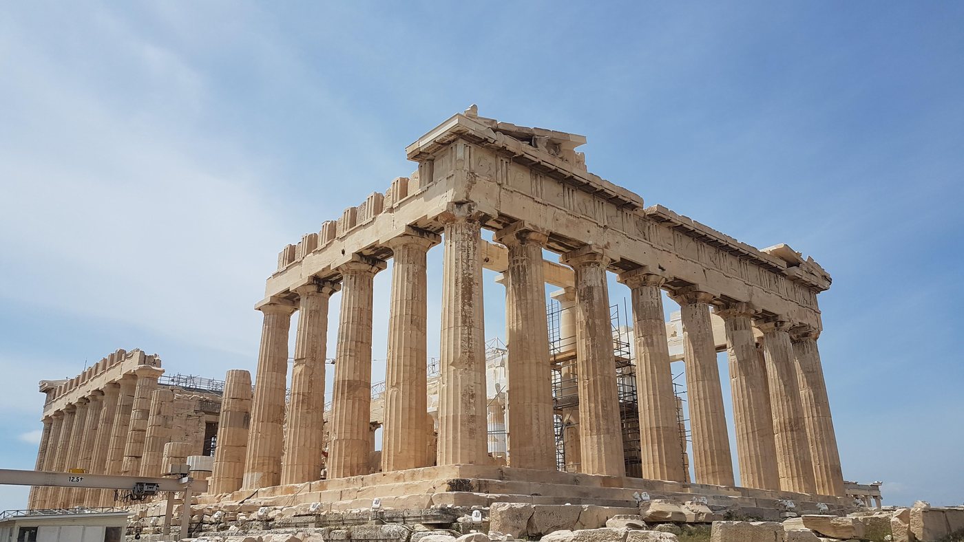 The Parthenon's east facade rising against a clear blue sky on the Acropolis